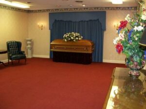 adcock funeral home facility interior with casket